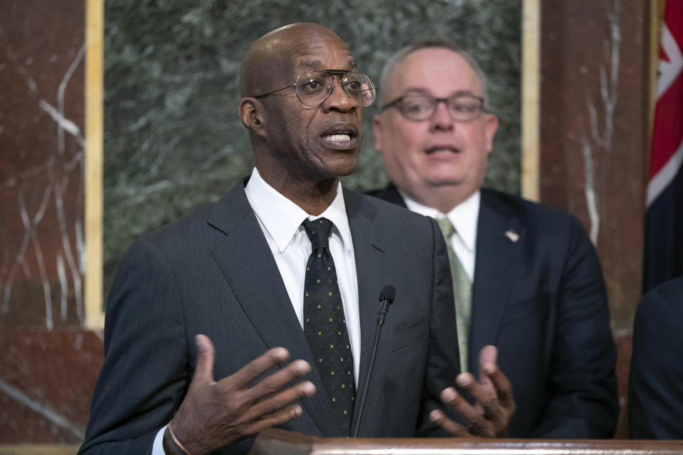 FILE - In this Wednesday, Oct. 31, 2018, file photo, Edwin Moses speaks at a news conference during a White House event aimed at reforming the World Anti-Doping Agency, in Washington. Formed with good intentions, WADA finds itself at a crossroads as it celebrates its 20th anniversary at a conference this week in Poland. It’s an agency riven with conflicts that have hindered its fight against drugs and exacerbated its 4-year-old struggle in the high-profile case against Russia. “One thing you can’t have is built-in interference,” said Moses, the Olympic champion who serves on WADA’s education committee and is also the former chairman of the U.S. Anti-Doping Committee. “You’ve got to cut your ties to everything.” (AP Photo/J. Scott Applewhite, File)