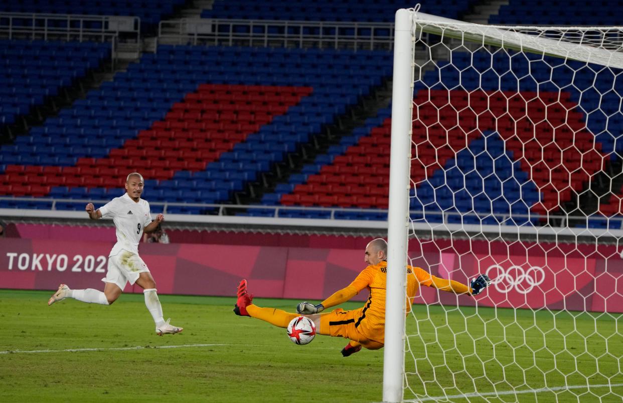 Japan's Daizen Maeda celebrates scoring his side's fourth goal against France during a men's soccer match at the 2020 Summer Olympics, Wednesday, July 28, 2021, in Yokohama.