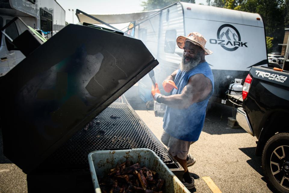 Michael "Shotgun" Collins, of Shotgun BBQ, works the grill at the 2nd annual Black BBQ Cook Off on Saturday, Aug. 19, 2023, at Murchison Marketplace.