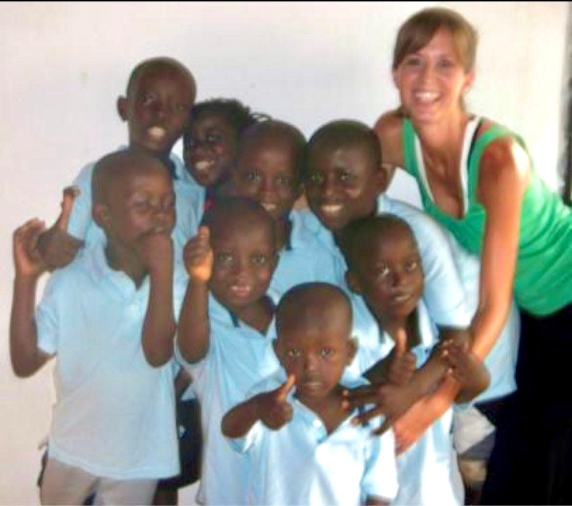 Hayley Jones in summer 2010 in an orphanage in Sierra Leone's capital city, the first time she met the eight siblings she and her husband would adopt in 2013