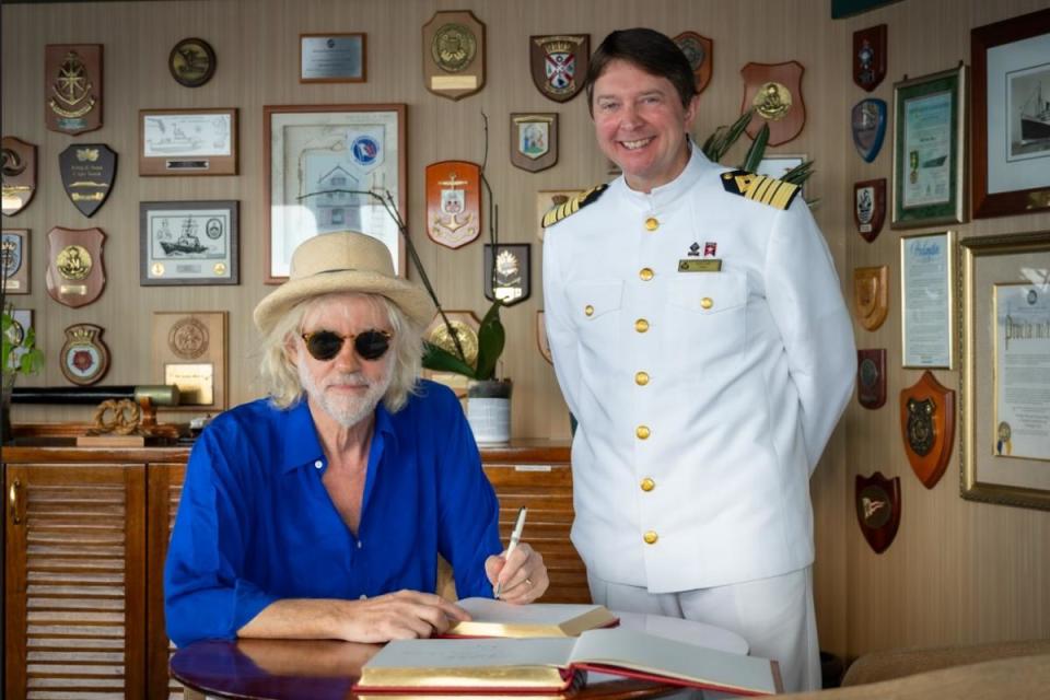 Sir Bob Geldof, pictured with Captain Andrew Hall  joins Queen Mary 2 for intimate Q&A with guests. <i>(Image: Cunard)</i>