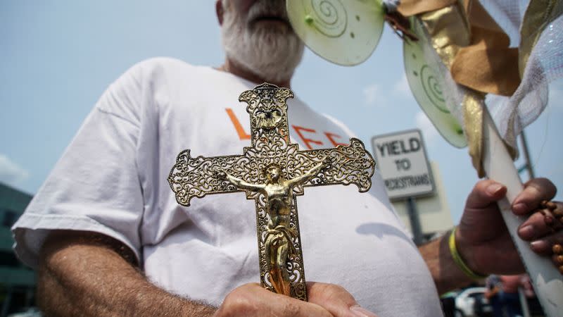 FILE PHOTO: A Pro-Life Supporter protests outside of Planned Parenthood as a deadline looms to renew the license of Missouri's sole remaining Planned Parenthood clinic in St. Louis