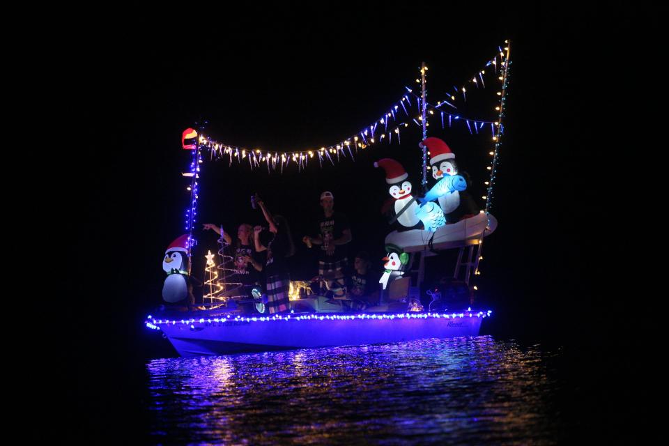 Boats participate in the annual Fort Myers Beach Christmas Boat Parade on Saturday, Dec. 2, 2023. The event was cancelled last year due to Hurricane Ian. People lined the shores and bridge to watch the annual event.