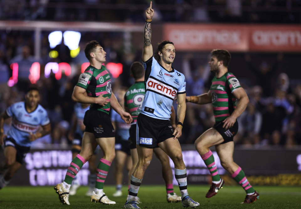 SYDNEY, AUSTRALIA - JULY 30:  Nicho Hynes of the Sharks celebrates kicking a field goal to win the match in golden point extra time during the round 20 NRL match between the Cronulla Sharks and the South Sydney Rabbitohs at PointsBet Stadium, on July 30, 2022, in Sydney, Australia. (Photo by Matt King/Getty Images)