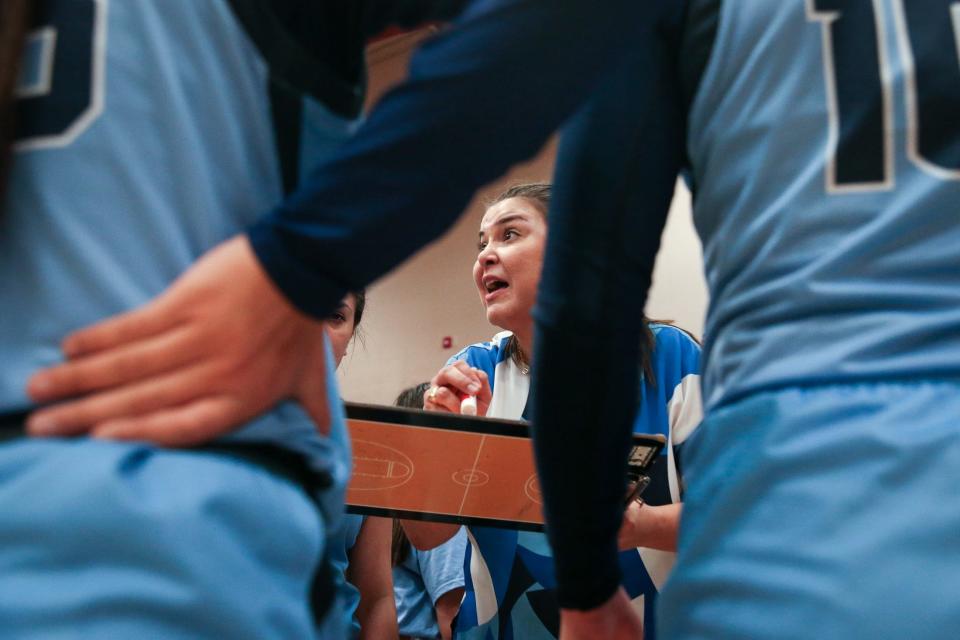 Carroll girls head basketball coach Lauren Bell speaks to the team during a timeout at the District 29-5A crossover playoff game on Tuesday, Feb. 6, 2024, in Portland, Texas.