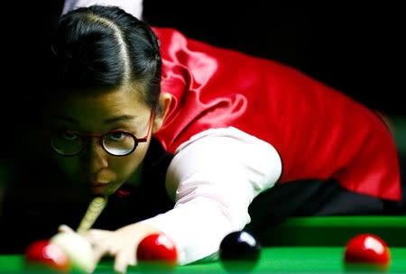 Ng On Yee of Hong Kong plays a shot during her semi-final match against Reanne Evans of England during the Eden World Women's Snooker Championship in Singapore March 19, 2017. REUTERS/Yong Teck Lim/Files