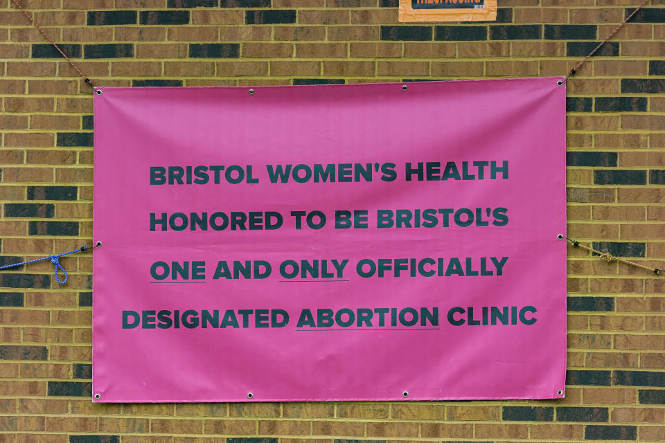 A temporary signs hangs on the outside of the Bristol Women's Health Clinic on Thursday, Feb. 23, 2023 in Bristol,Va., Residents in southwestern Virginia have battled for months over whether abortion clinics limited by strict laws in other states should be allowed to hop over the border and operate there. Similar scenarios are beginning to play out in communities along state lines around the country since the U.S. Supreme Court overturned Roe v. Wade. (AP Photo/Earl Neikirk)