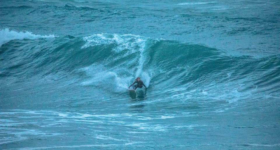 Huge wave shown as surfer takes on massive swell in Sydney on Thursday evening.