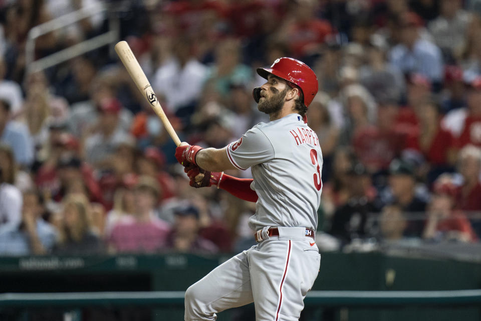 Philadelphia Phillies' Bryce Harper watches his home run during the eighth inning of a baseball game against the Washington Nationals in Washington, Tuesday, Aug. 3, 2021. (AP Photo/Manuel Balce Ceneta)