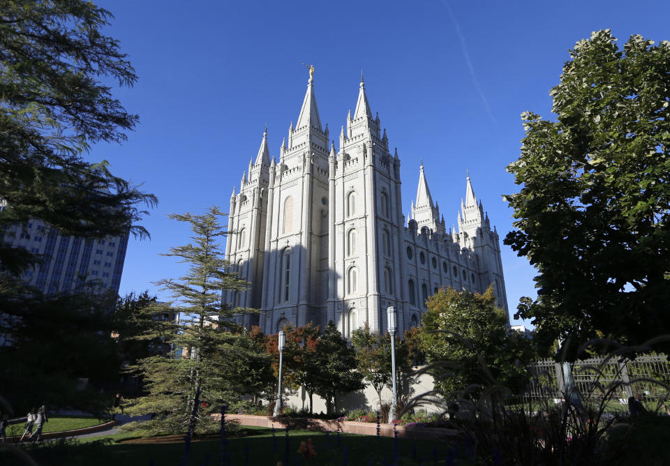FILE - In this Oct. 5, 2019, file photo, The Salt Lake Temple stands at Temple Square in Salt Lake City. The Church of Jesus Christ of Latter-day Saints has announced that face masks will be required inside temples to limit the spread of COVID-19. Church leaders said Wednesday, Sept. 22, 2021, that masks will be required temporarily in an effort to keep temples open. (AP Photo/Rick Bowmer, File)