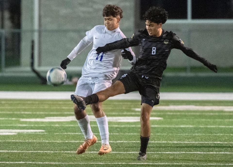 Tokay's Jordan Hernandez, left, and St. Mary's Leandro Solorzano fight the ball during a boys soccer game at St. Mary's Sanguinetti Field in Stockton on Jan. 12, 2024.