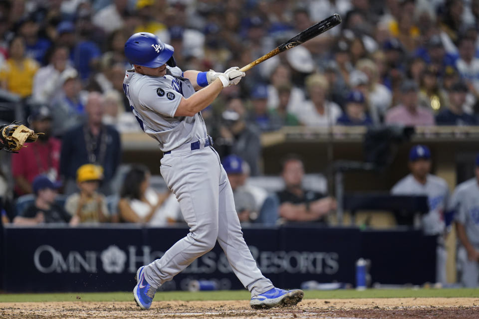 Los Angeles Dodgers' Will Smith follows through on a home run during the eighth inning of the team's baseball game against the San Diego Padres, Wednesday, Aug. 25, 2021, in San Diego. (AP Photo/Gregory Bull)