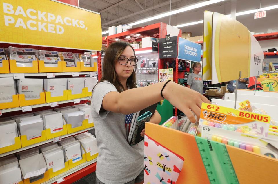 Jessica Love, 17, a senior at Portage Lake Career Center, shops for school supplies Monday at Staples on Arlington Road in Akron.