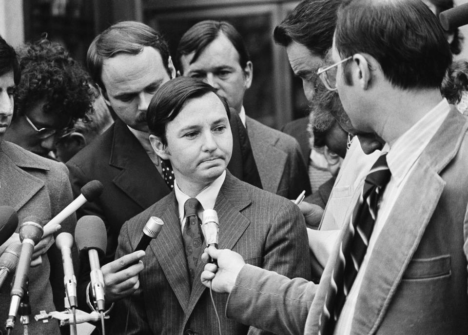 Donald Segretti, a political saboteur financed with Nixon campaign funds, is surrounded by newsmen as he listens to questions outside the U.S. District court in Washington, Oct. 2, 1973, after pleading guilty to three charges of violating federal election laws during the 1972 Democratic presidential primary in Florida. (AP Photo) (Photo: ASSOCIATED PRESS)