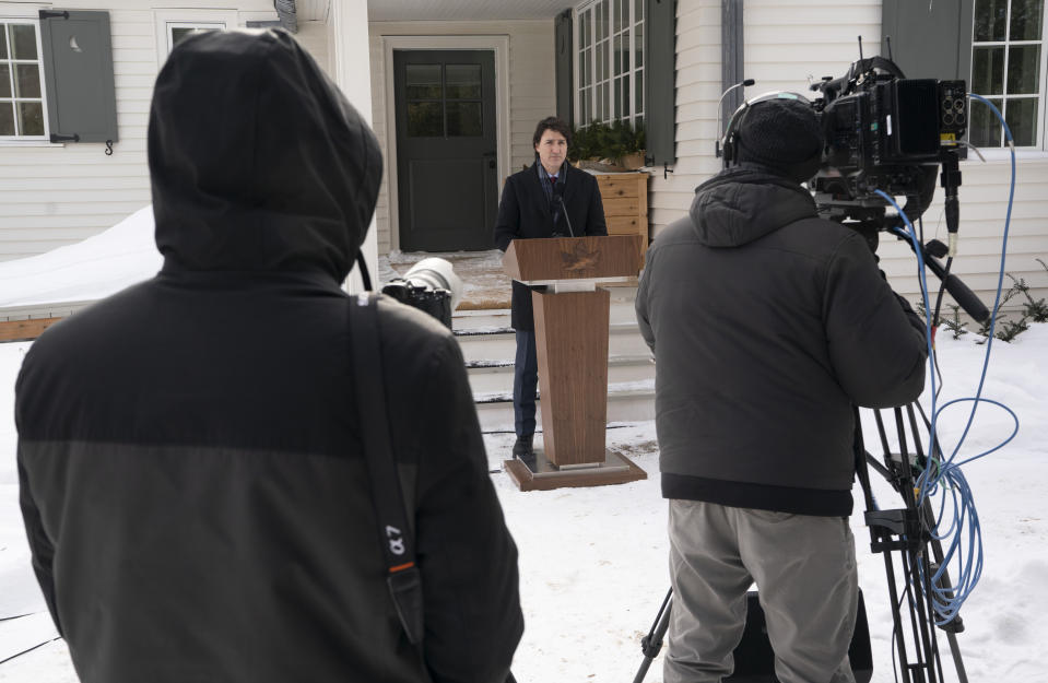 Cameras record Canadian Prime Minister Justin Trudeau as he speaks during a media availability held at a secure location, Monday, Jan. 31, 2022 in the National Capital Region. Trudeau announced Monday he has tested positive for COVID-19 but is “feeling fine” and will continue to work remotely from home. Trudeau announced Monday he has tested positive for COVID-19 but is “feeling fine” and will continue to work remotely from home. (Adrian Wyld/The Canadian Press via AP)