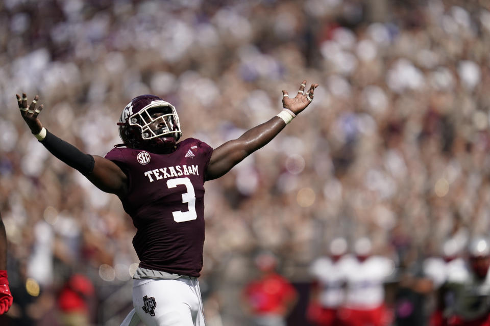 Texas A&M defensive lineman Tyree Johnson (3) reacts after sacking New Mexico quarterback Terry Wilson (2) during the first half of an NCAA college football game on Saturday, Sept. 18, 2021, in College Station, Texas. (AP Photo/Sam Craft)