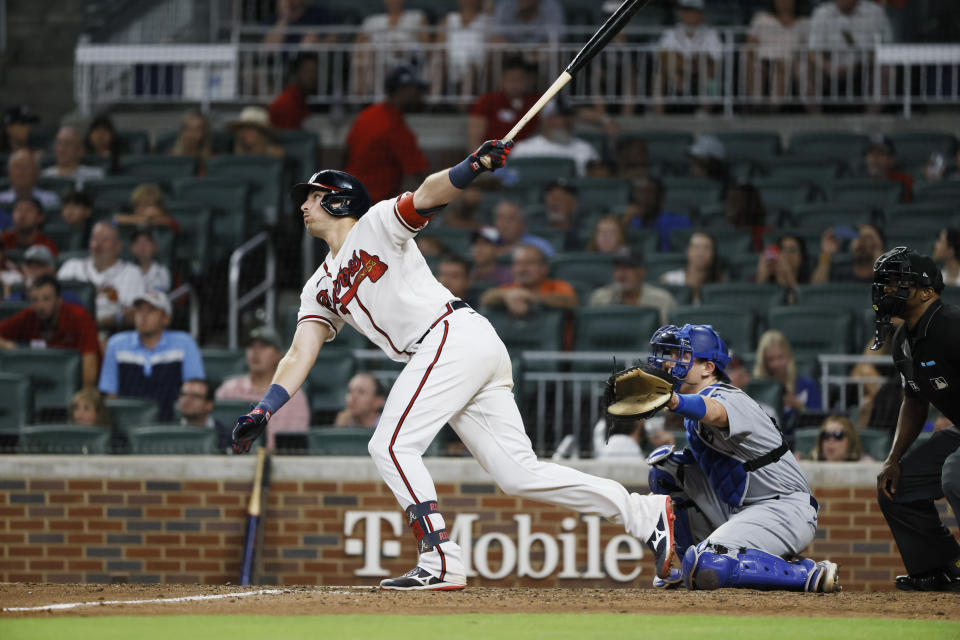 Atlanta Braves' Austin Riley hits an RBI single, scoring Michael Harris II during the seventh inning of a baseball game won by the Los Angeles Dodgers 5-3 on Sunday, June 26, 2022, in Atlanta. (AP Photo/Bob Andres)