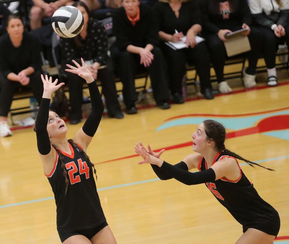 Marlington's Janelle Swisher, left, sets for Emily Gainer during a regional final win over Copley, Nov. 4, 2023.