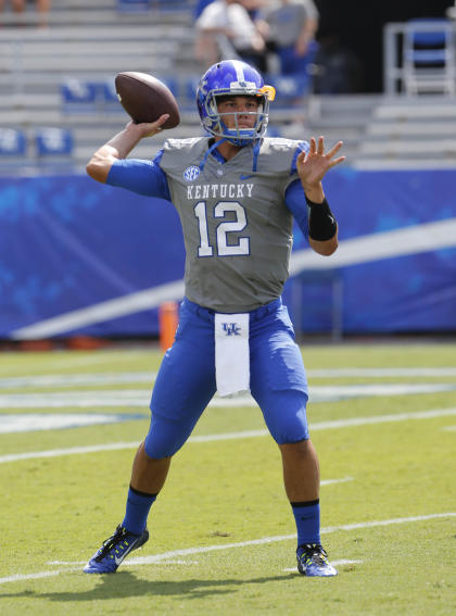 Sep 6, 2014; Lexington, KY, USA; Kentucky Wildcats quarterback Reese Phillips (12) before the game against the Ohio Bobcats at Commonwealth Stadium. (Mark Zerof-USA TODAY Sports)