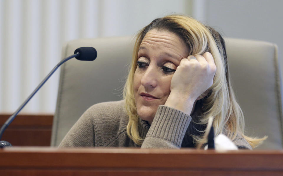 Lisa Britt pauses before answering a question by executive director of the Board of Elections Kim Strach during the public evidentiary hearing on the 9th Congressional District investigation Monday, Feb. 18, 2019, at the North Carolina State Bar in Raleigh, N.C. (Juli Leonard/The News & Observer via AP, Pool)