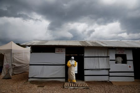 FILE PHOTO: A health worker wearing Ebola protection gear, leaves the dressing room before entering the Biosecure Emergency Care Unit at the ALIMA Ebola treatment centre in Beni