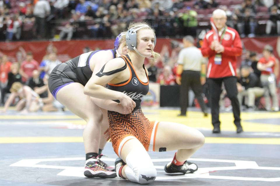 Waverly's Abby Green grapples with Vermillion's Emily Stiner during the fifth place match for the 140-pound bracket at the OHSAA state wrestling championships at The Schottenstein Center in Columbus, Ohio, on March 10, 2024.