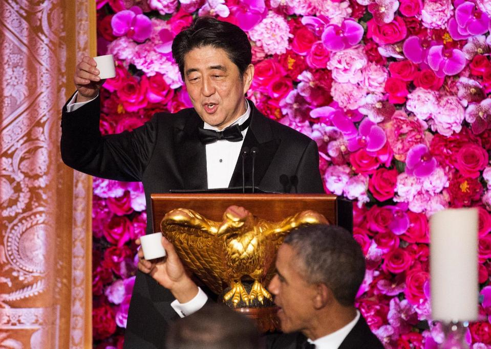 Japanese PM Abe makes a toast to U.S. President Obama at a State Dinner at the White House