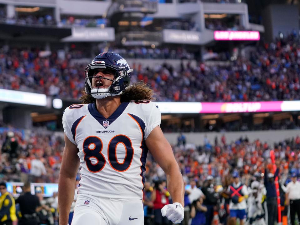 Greg Dulcich celebrates a touchdown against the Los Angeles Chargers.