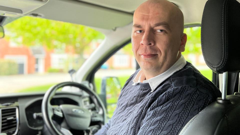 Vladmir Kubjatko in his taxi