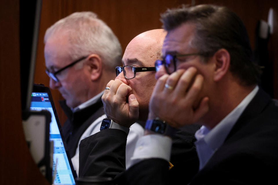 Traders work on the floor of the New York Stock Exchange (NYSE) in New York City, U.S., December 7, 2022. REUTERS/Brendan McDermid