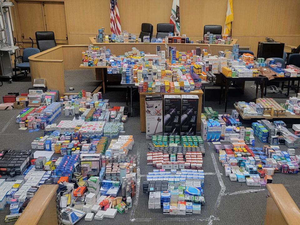 Courtroom with piles of personal care items stolen in organized retail crime