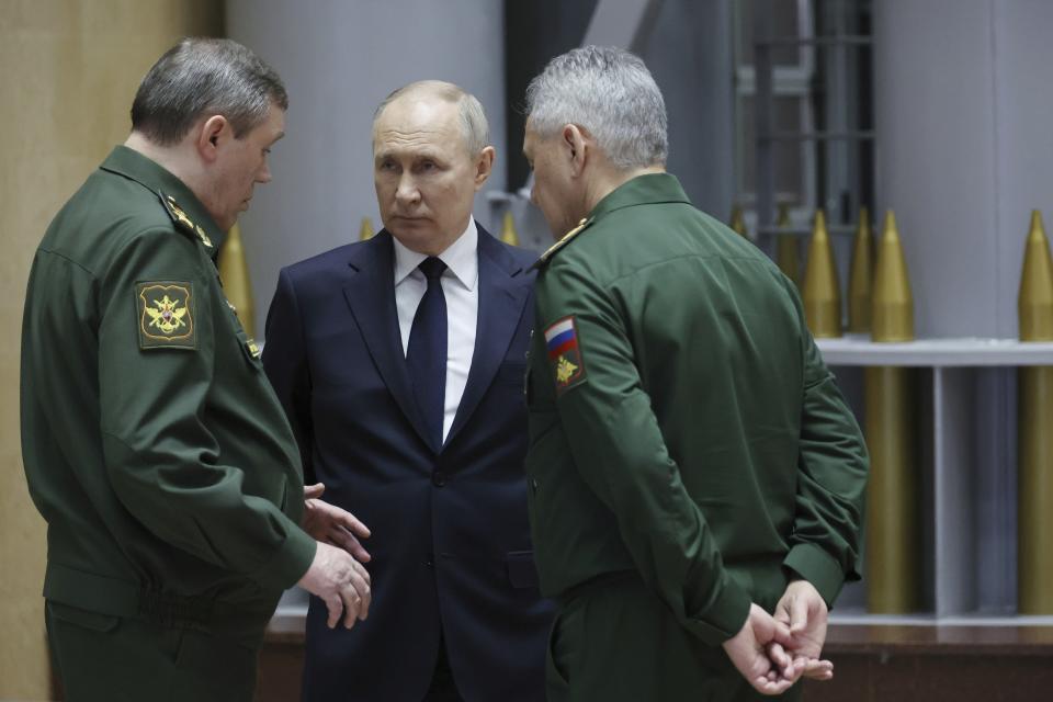 FILE - Russian President Vladimir Putin, center, talks with Gen. Valery Gerasimov, left, chief of the General Staff, and Defense Minister Sergei Shoigu after a meeting in Moscow, Russia, on Dec. 19, 2023. An armed uprising by mercenary chief Yevgeny Prigozhin on June 23-24, 2023, against the military leadership dealt a blow to Putin’s authority. (Mikhail Klimentyev, Sputnik, Kremlin Pool Photo via AP, File)