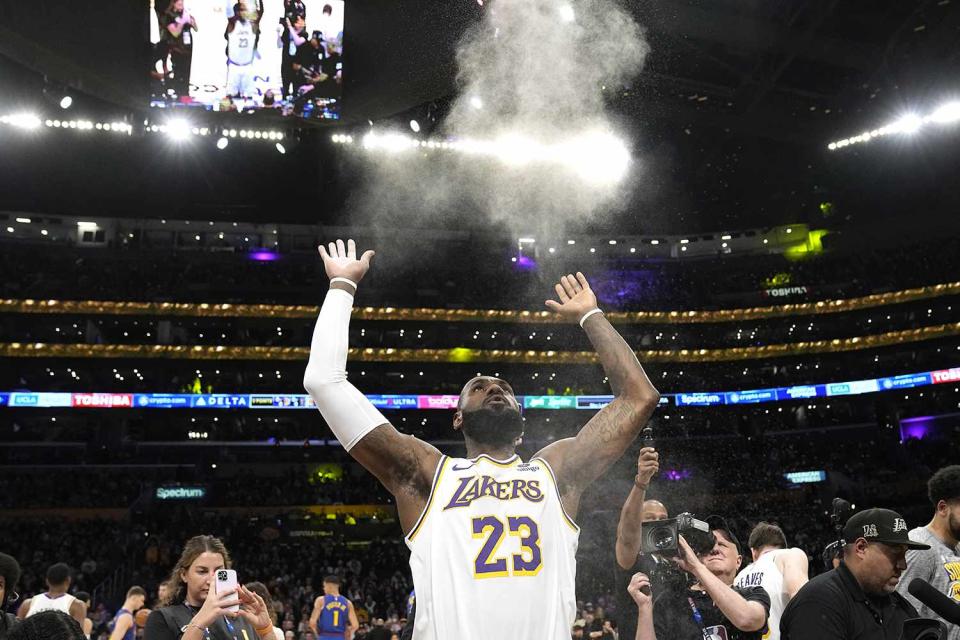 <p>AP Photo/Mark J. Terrill</p> LeBron James tosses powder in the air before his game against the Denver Nuggets 