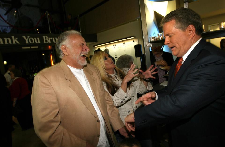 KSL-TV anchor Bruce Lindsay is greeted by former KSL-TV anchor Dick Nourse during a retirement reception in Lindsay’s honor on May 23, 2012, at KSL Broadcast House in Salt Lake City. | Chuck Wing, Deseret News