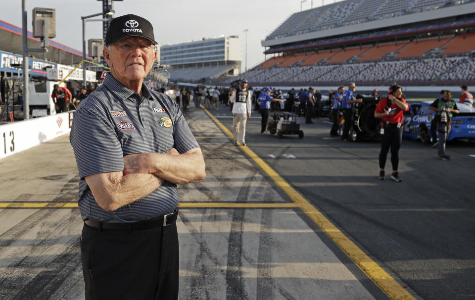 FILE - In this May 23, 2019, file photo, Team owner Joe Gibbs looks down pit road before qualifications for the NASCAR Cup Series auto race at Charlotte Motor Speedway in Concord, N.C. NASCAR's season officially opens Sunday, Feb. 16, 2020, with the Daytona 500 at Daytona International Speedway. (AP Photo/Chuck Burton, File)