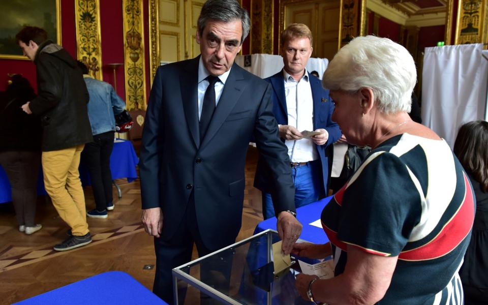 Francois Fillon, member of the Republicans political party of the French centre-right, casts his vote - Credit: Christophe Archambault/ REUTERS