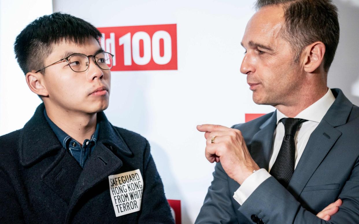 China is furious at a meeting between democracy activists Joshua Wong (left) and Heiko Maas, the German foreign minister (right) in Berlin - DPA