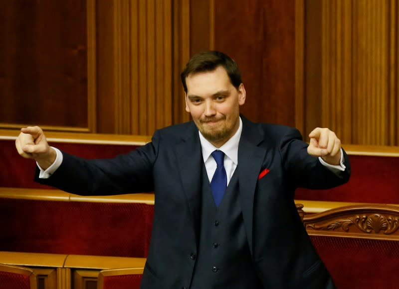 Ukrainian Prime Minister Oleksiy Honcharuk reacts after lawmakers voted to remove a ban on the sale of farmland, at the parliament building in Kiev