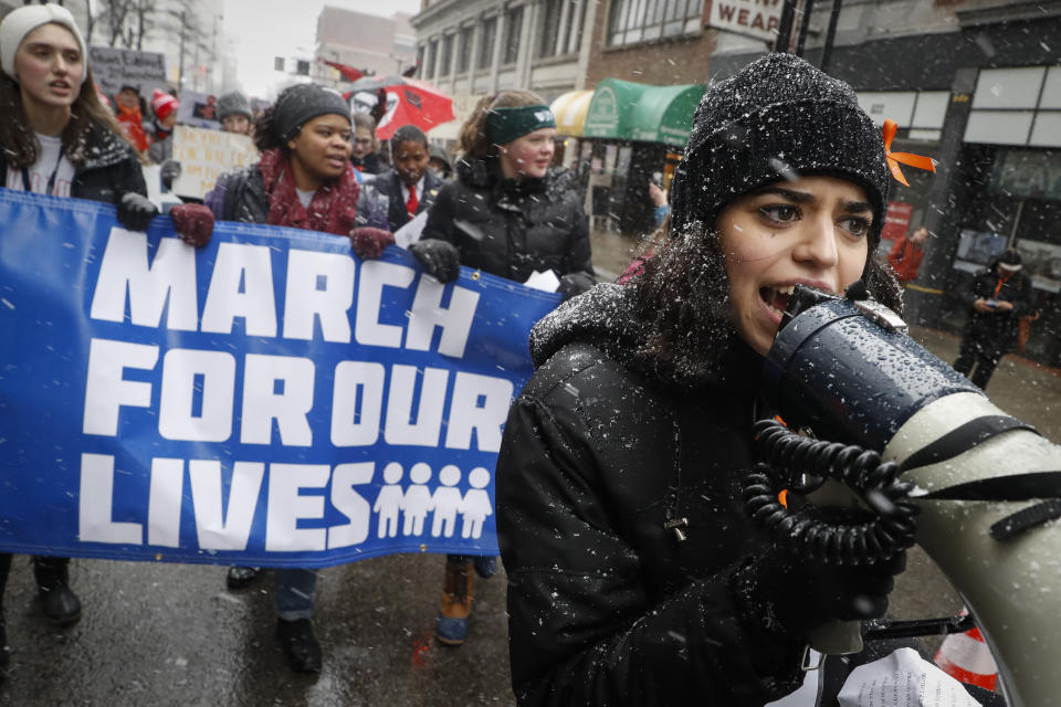 FILE - Organizer Rasleen Krupp, 17, Wyoming High School, leads a "March for Our Lives" protest for gun legislation and school safety, Saturday, March 24, 2018, in Cincinnati. Students and activists across the country planned events Saturday in conjunction with a Washington march spearheaded by teens from Marjory Stoneman Douglas High School in Parkland, Fla., where over a dozen people were killed in February. (AP Photo/John Minchillo, File)