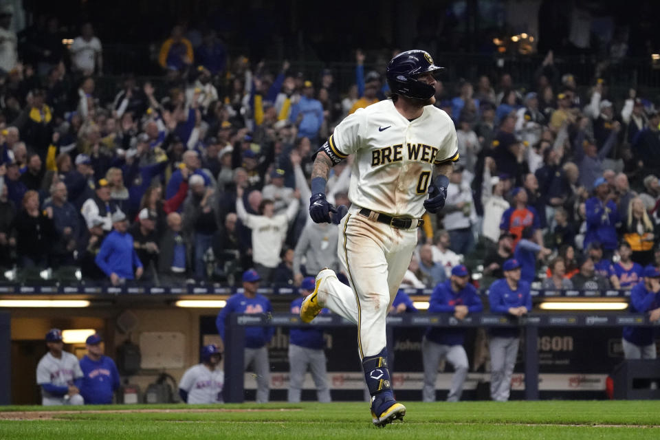 Milwaukee Brewers' Brice Turang watches the ball after hitting a grand slam during the fifth inning of a baseball game against the New York Mets Monday, April 3, 2023, in Milwaukee. (AP Photo/Aaron Gash)