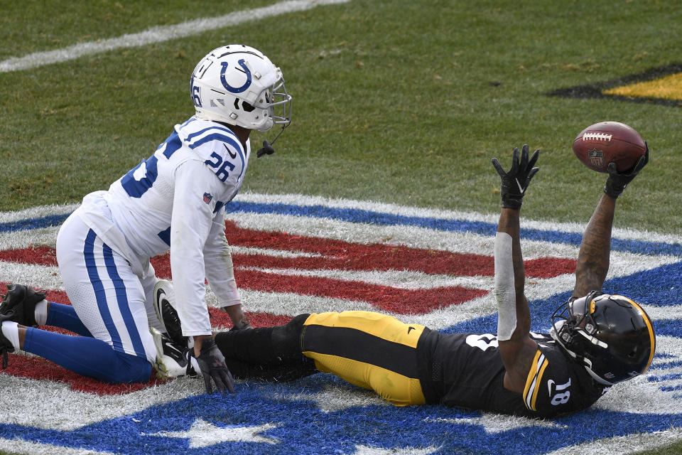 Pittsburgh Steelers wide receiver Diontae Johnson (18) celebrates in the end zone in front of Indianapolis Colts cornerback Rock Ya-Sin (26) after making a touchdown during the second half of an NFL football game, Sunday, Dec. 27, 2020, in Pittsburgh. (AP Photo/Don Wright)