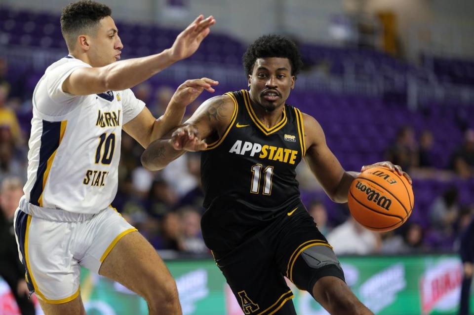 Nov 22, 2023; Fort Myers, FL, USA; Appalachian State Mountaineers forward Donovan Gregory (11) drives to the hoop past Murray State Racers guard Quincy Anderson (10) in the second half during the Fort Myers Tip-Off at Suncoast Credit Union Arena. Mandatory Credit: Nathan Ray Seebeck-USA TODAY Sports