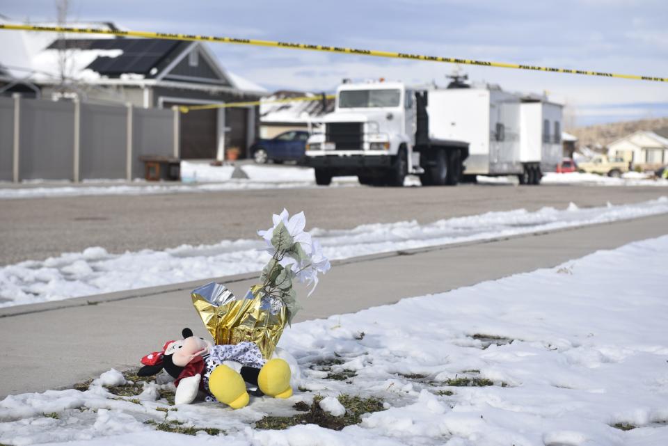 A small monument of toys and flowers sit in front of the police tape left outside a home in Enoch where police say a 42-year-old man shot his wife, his mother-in-law, his five children and himself in a murder-suicide on Wednesday.