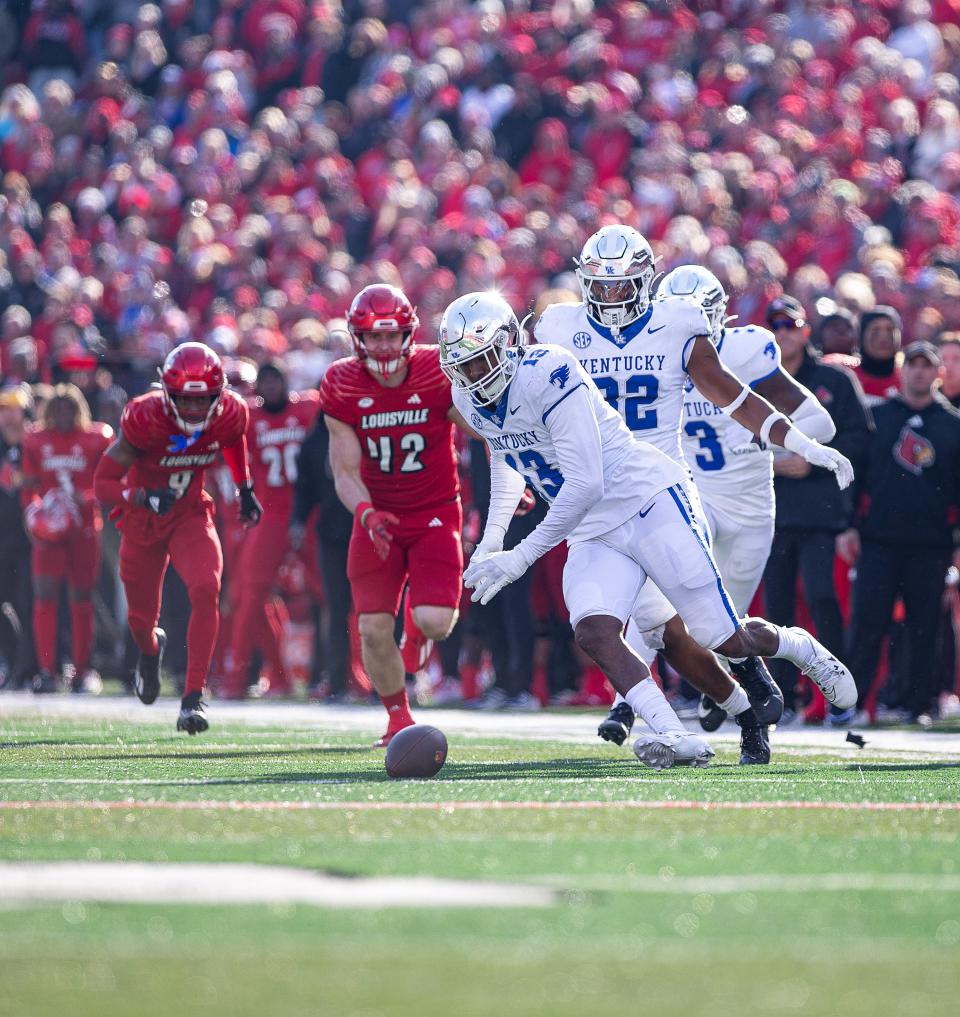 Kentucky's J.J. Weaver dives on a fumble by Louisville's Jack Plummer on Saturday at L&N Stadium.