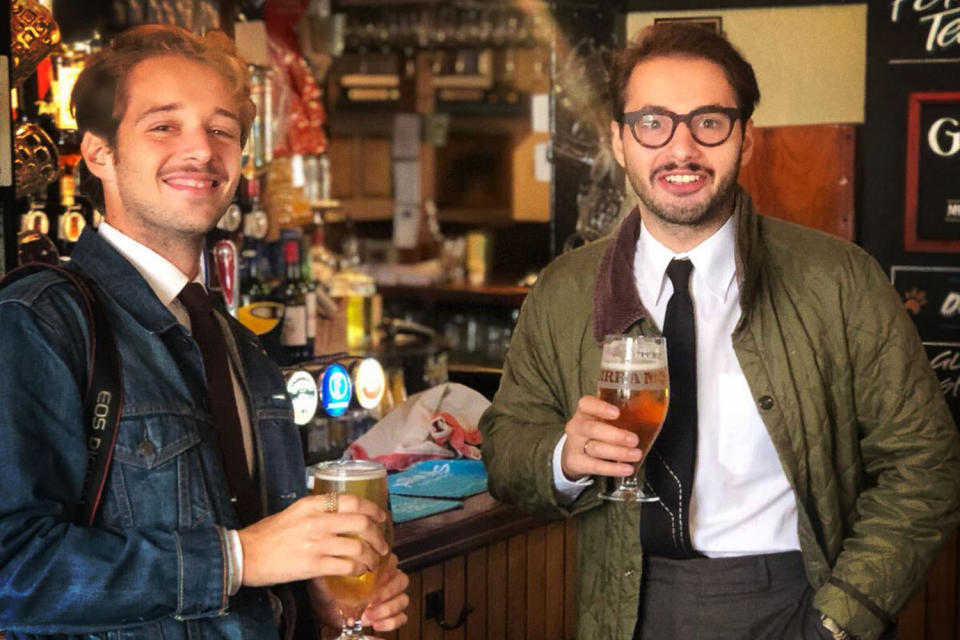 <div class="cell medium-auto caption">The author (left) with his brother, at a proper English pub</div> <div class="cell medium-shrink medium-text-right credit">Free Use</div>