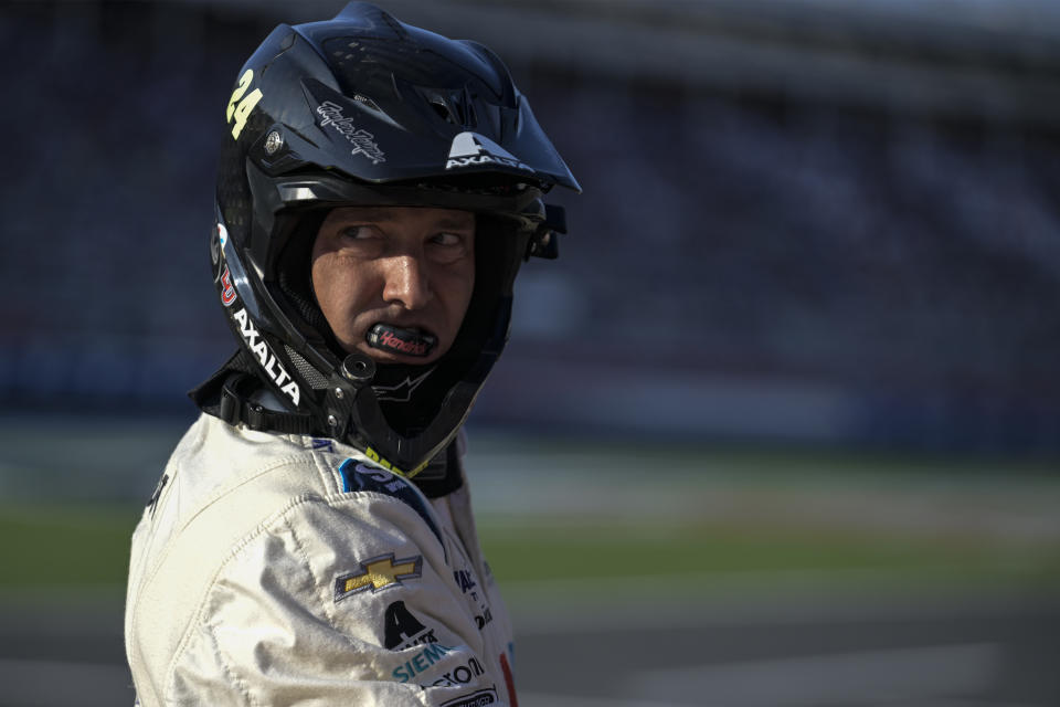 A pit crew member for William Byron (24) looks on during a NASCAR Cup Series auto race at Charlotte Motor Speedway, Sunday, Oct. 9, 2022, in Concord, N.C. (AP Photo/Matt Kelley)