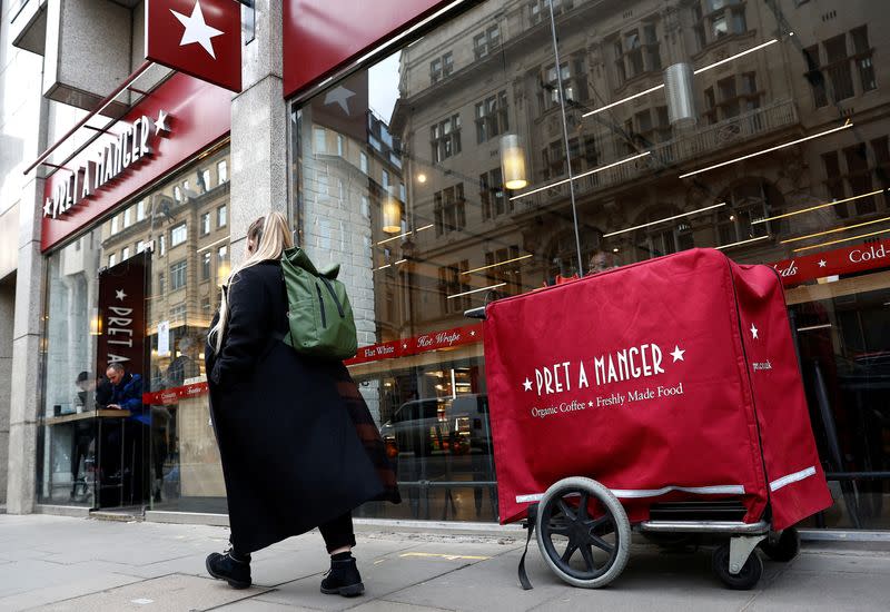 A person walks past a Pret a Manger outlet in London