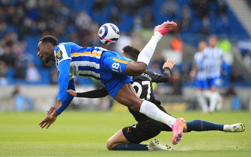 Danny Welbeck of Brighton (L) in action against Joao Cancelo of Manchester City - Shutterstock