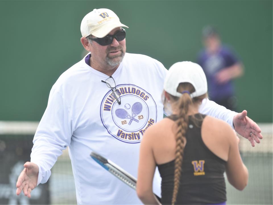 Abilene Wylie coach Mark Hathorn talks to Stealey Crousen during a break in the mixed doubles Class 5A state semifinals against Frisco Lebanon Trail's Ashna Potluri and Aaditt Risha. Crousen and teammate Trevor Short won 6-4, 6-1 on Tuesday at Northside Tennis Courts in Helotes.