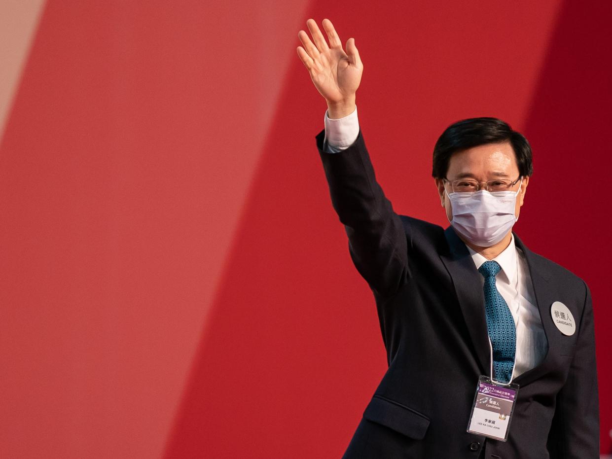 Hong Kong Chief Executive-elect John Lee Ka-chiu waves on stage after being elected at the Exhibition and Convention Centre on May 08, 2022 in Hong Kong, China.